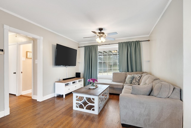 living room featuring crown molding, ceiling fan, and hardwood / wood-style floors