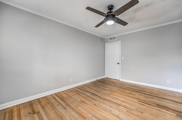 unfurnished room featuring crown molding, ceiling fan, a textured ceiling, and light hardwood / wood-style flooring