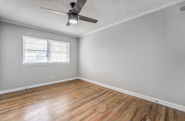 spare room with crown molding, hardwood / wood-style floors, ceiling fan, and a textured ceiling