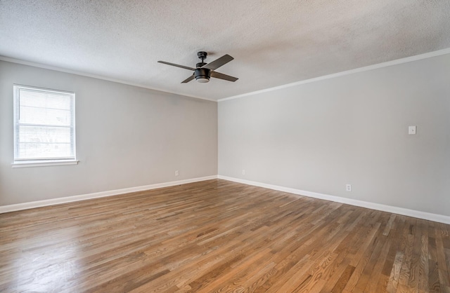 unfurnished room featuring wood-type flooring, ornamental molding, ceiling fan, and a textured ceiling