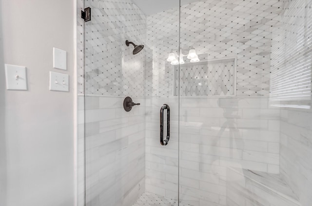 bathroom with a shower with shower door