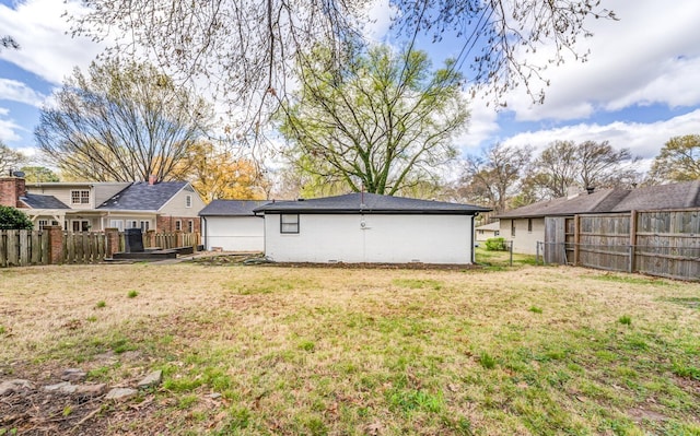 back of property featuring a lawn