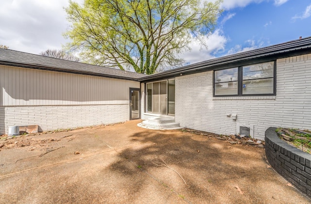 view of property exterior featuring a patio