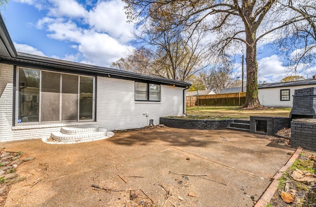 rear view of property featuring a patio