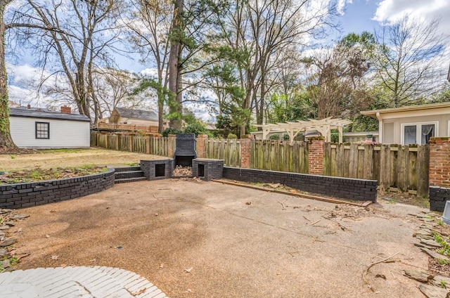 view of patio featuring a pergola and a fireplace