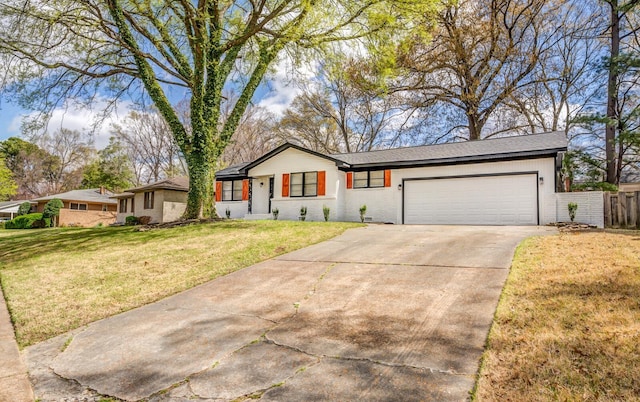 view of front of house with a garage and a front yard