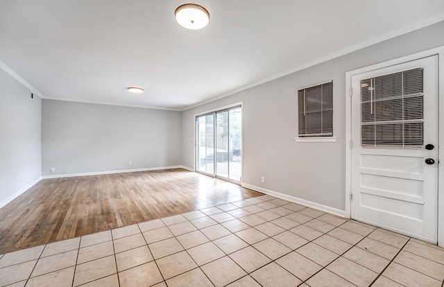 unfurnished room with ornamental molding and light hardwood / wood-style floors