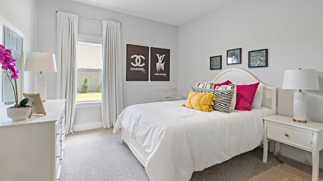 bedroom featuring light carpet