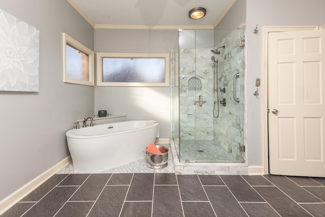 bathroom with tile patterned flooring, ornamental molding, and separate shower and tub