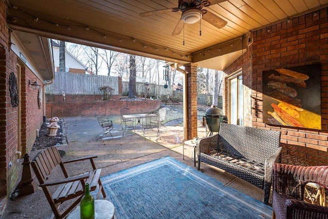 view of patio featuring ceiling fan