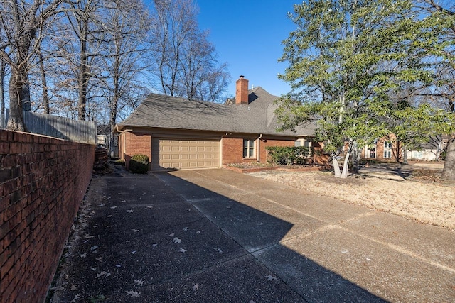 view of side of home featuring a garage