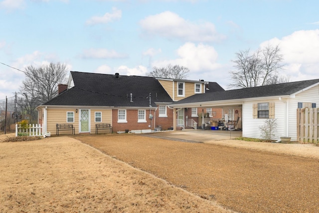 back of property featuring a carport