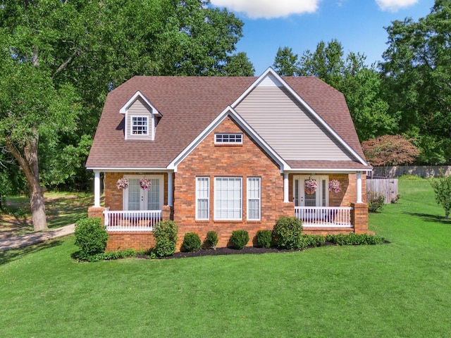 view of front of property featuring a front lawn and covered porch