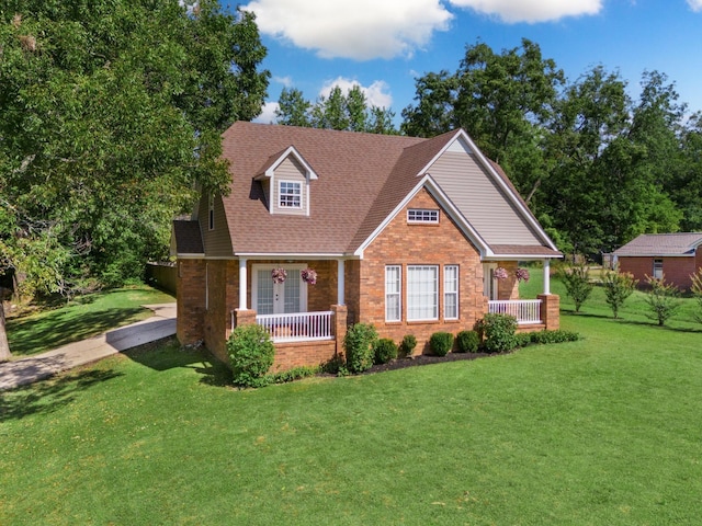 view of front of home featuring a front yard and covered porch