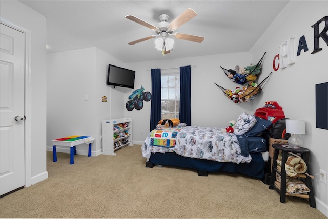 carpeted bedroom with ceiling fan