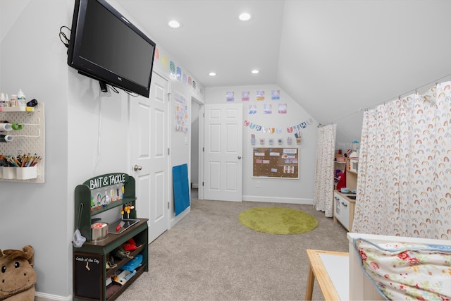 bedroom featuring vaulted ceiling and light colored carpet