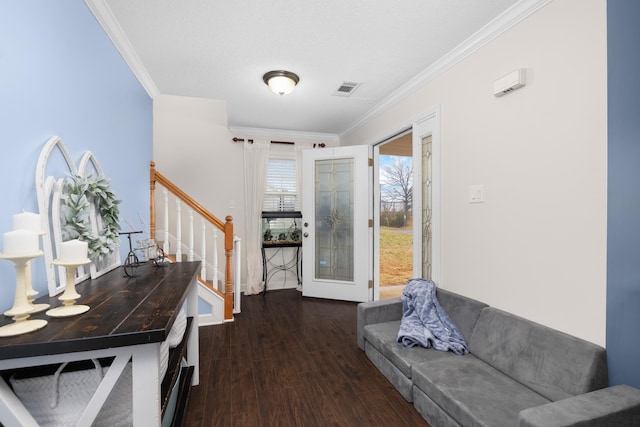 entrance foyer featuring ornamental molding and dark hardwood / wood-style floors