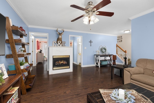 living room with crown molding, dark hardwood / wood-style floors, and ceiling fan