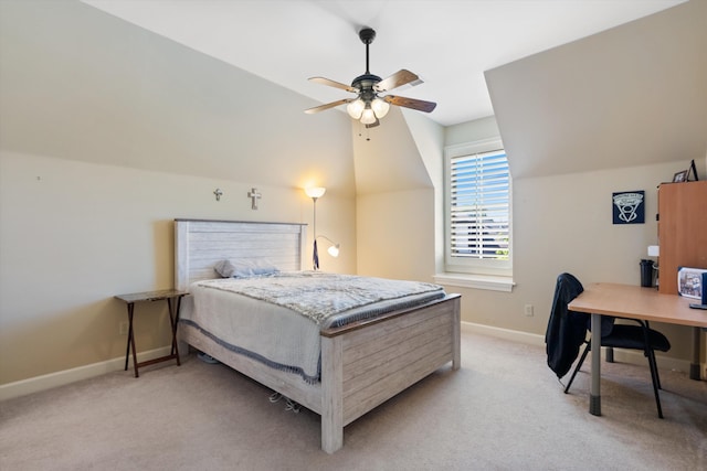 carpeted bedroom featuring vaulted ceiling and ceiling fan