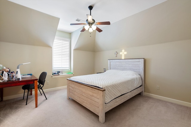 bedroom featuring vaulted ceiling, light colored carpet, and ceiling fan