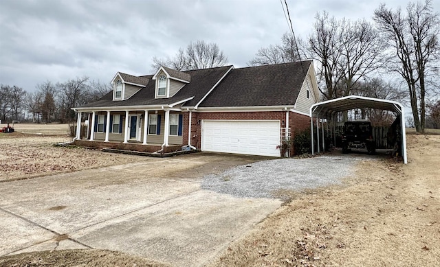 view of front of house with a carport, a garage, and covered porch