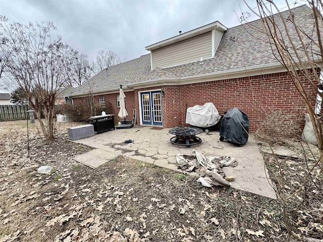 back of house featuring french doors, a patio, and an outdoor fire pit