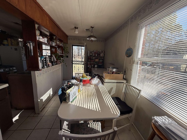 dining area with light tile patterned floors