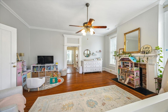 living room featuring crown molding, dark hardwood / wood-style floors, and ceiling fan