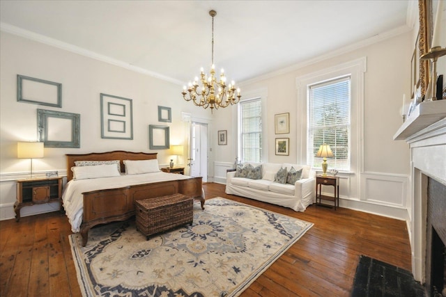 bedroom with crown molding, dark hardwood / wood-style floors, and a notable chandelier