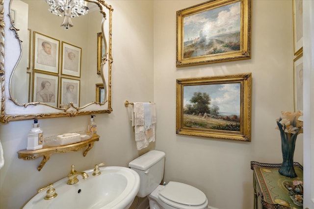 bathroom featuring sink and toilet