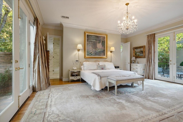 bedroom featuring crown molding, access to exterior, light wood-type flooring, and french doors