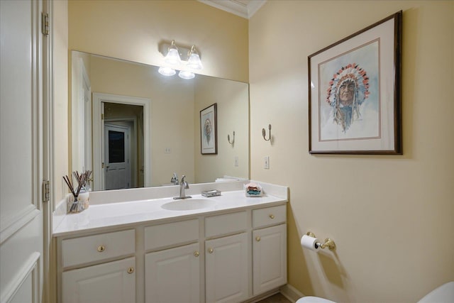 bathroom with vanity and ornamental molding