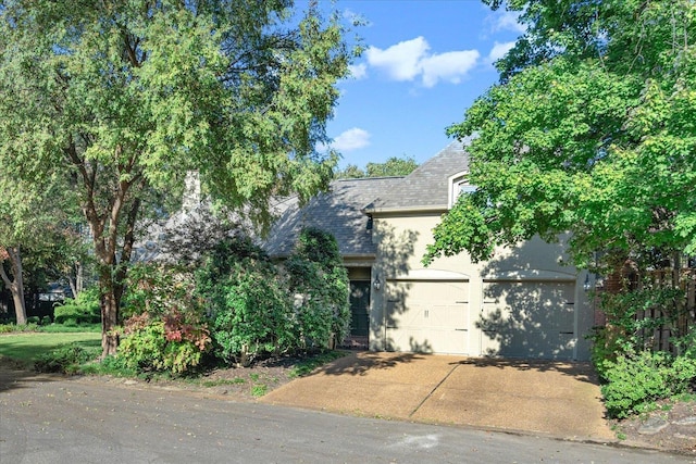 view of property hidden behind natural elements