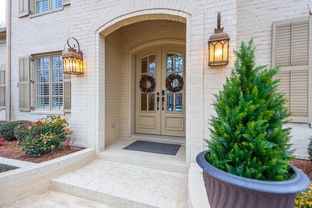 property entrance featuring french doors