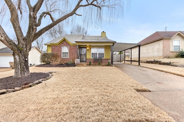 view of front of property with a carport