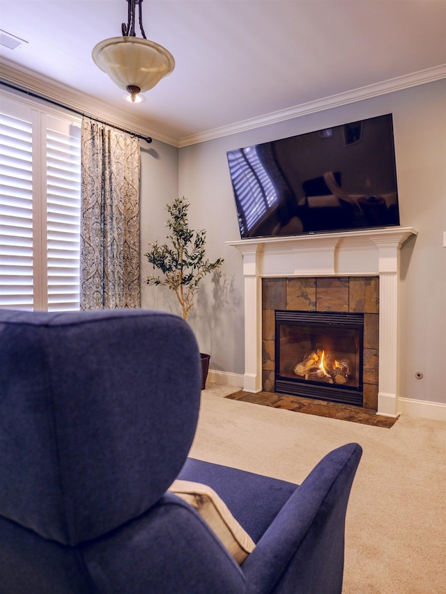 carpeted living room featuring ornamental molding and a fireplace