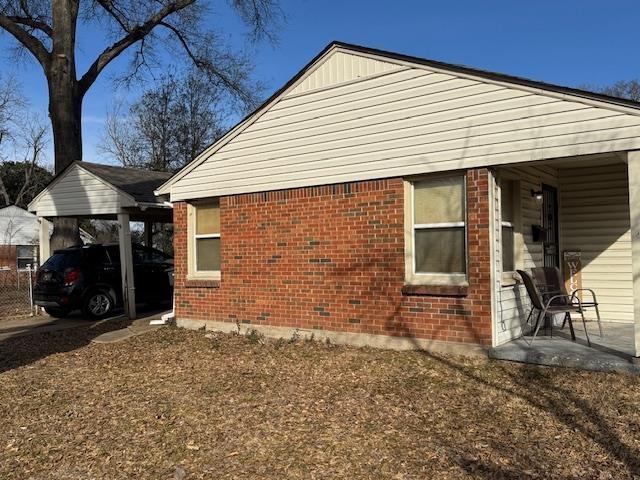 view of home's exterior with a carport