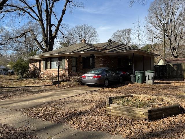 exterior space featuring a carport