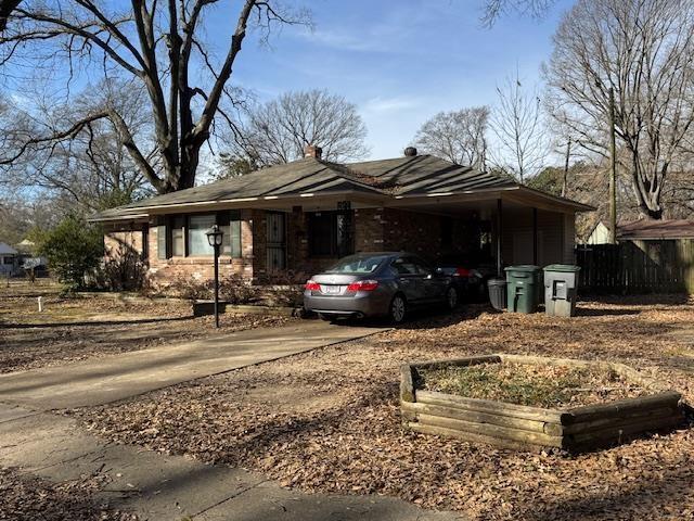 exterior space featuring a carport