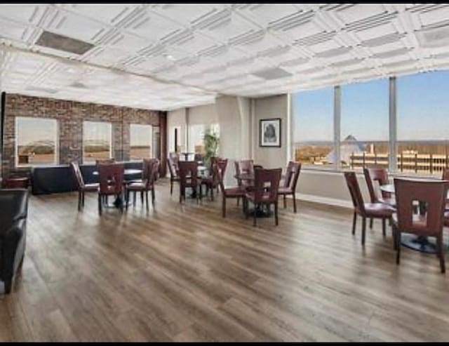 dining area with hardwood / wood-style floors