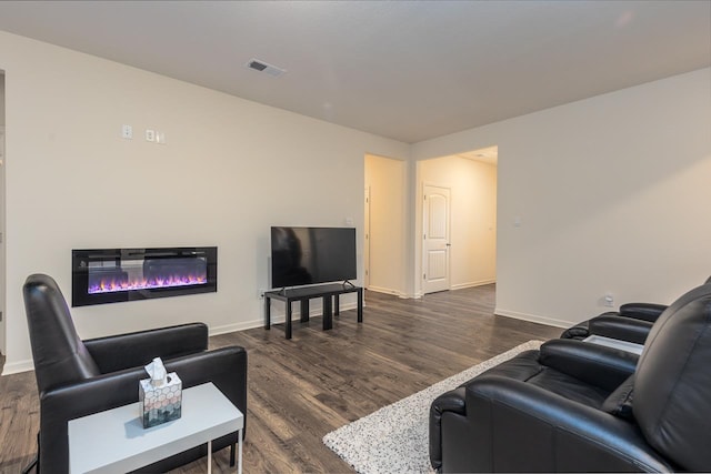 living room featuring dark hardwood / wood-style flooring