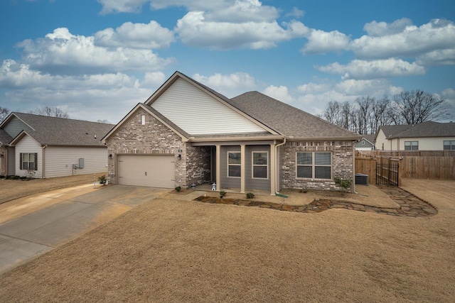 craftsman-style house featuring cooling unit and a garage