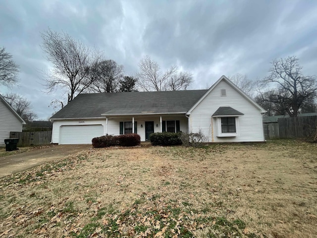 view of front of property featuring a garage and a front yard