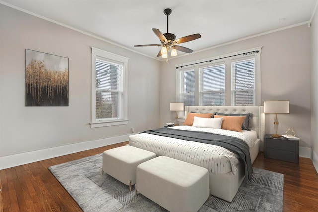 bedroom with crown molding, ceiling fan, and dark hardwood / wood-style flooring