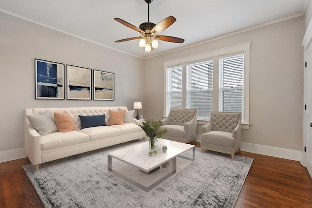 living room featuring ornamental molding, dark wood-type flooring, and ceiling fan