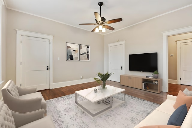 living room with crown molding, ceiling fan, and hardwood / wood-style flooring