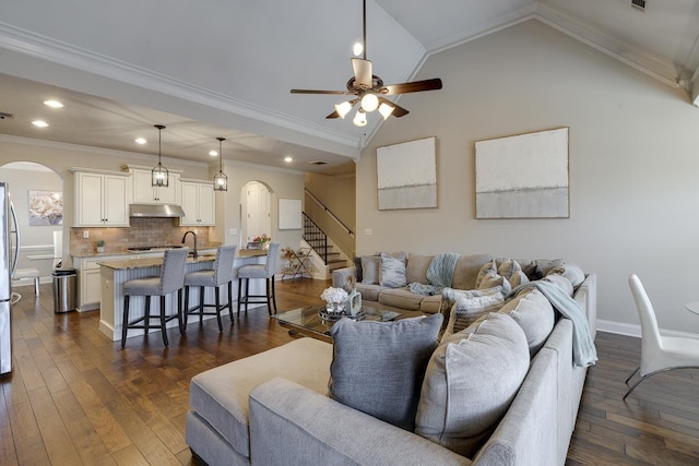 living room with crown molding, ceiling fan, lofted ceiling, and dark hardwood / wood-style flooring