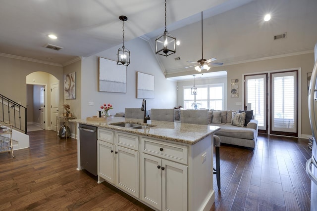 kitchen featuring white cabinetry, sink, an island with sink, and dishwasher