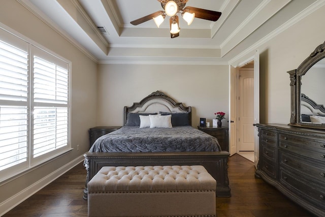 bedroom featuring a raised ceiling, crown molding, ceiling fan, and dark hardwood / wood-style flooring