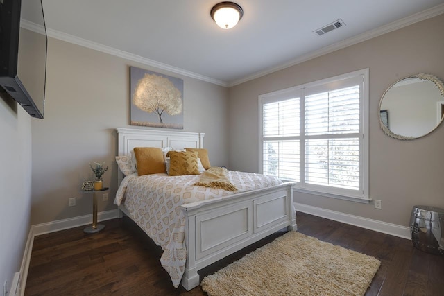 bedroom with crown molding and dark hardwood / wood-style floors